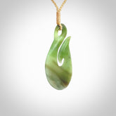 Hand carved New Zealand Jade hook pendant.